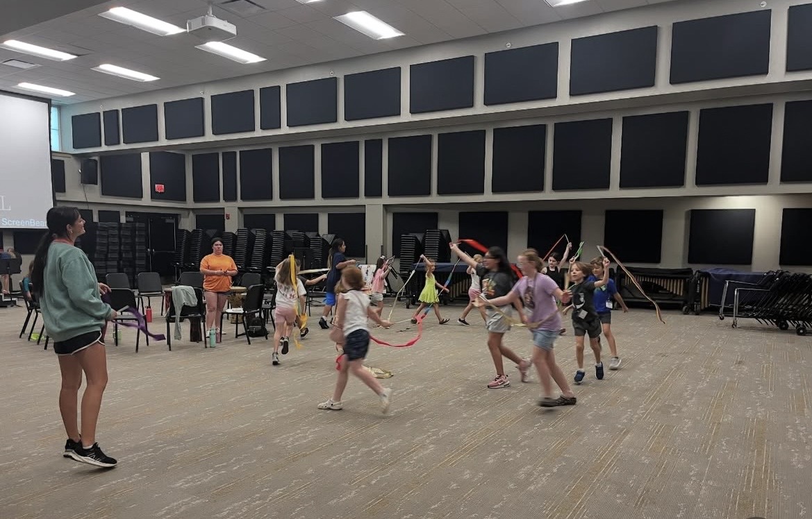 Mandy Quinn leading an elementary percussion and movement workshop with young students